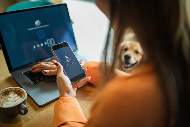 woman entering MFA info into phone to access software