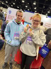 attendees holding Gingr stickers