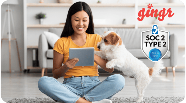 pet parent seated on iPad with dog demonstrating data security in pet care business app