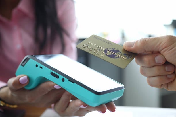 pet business staff collecting credit card payment on terminal