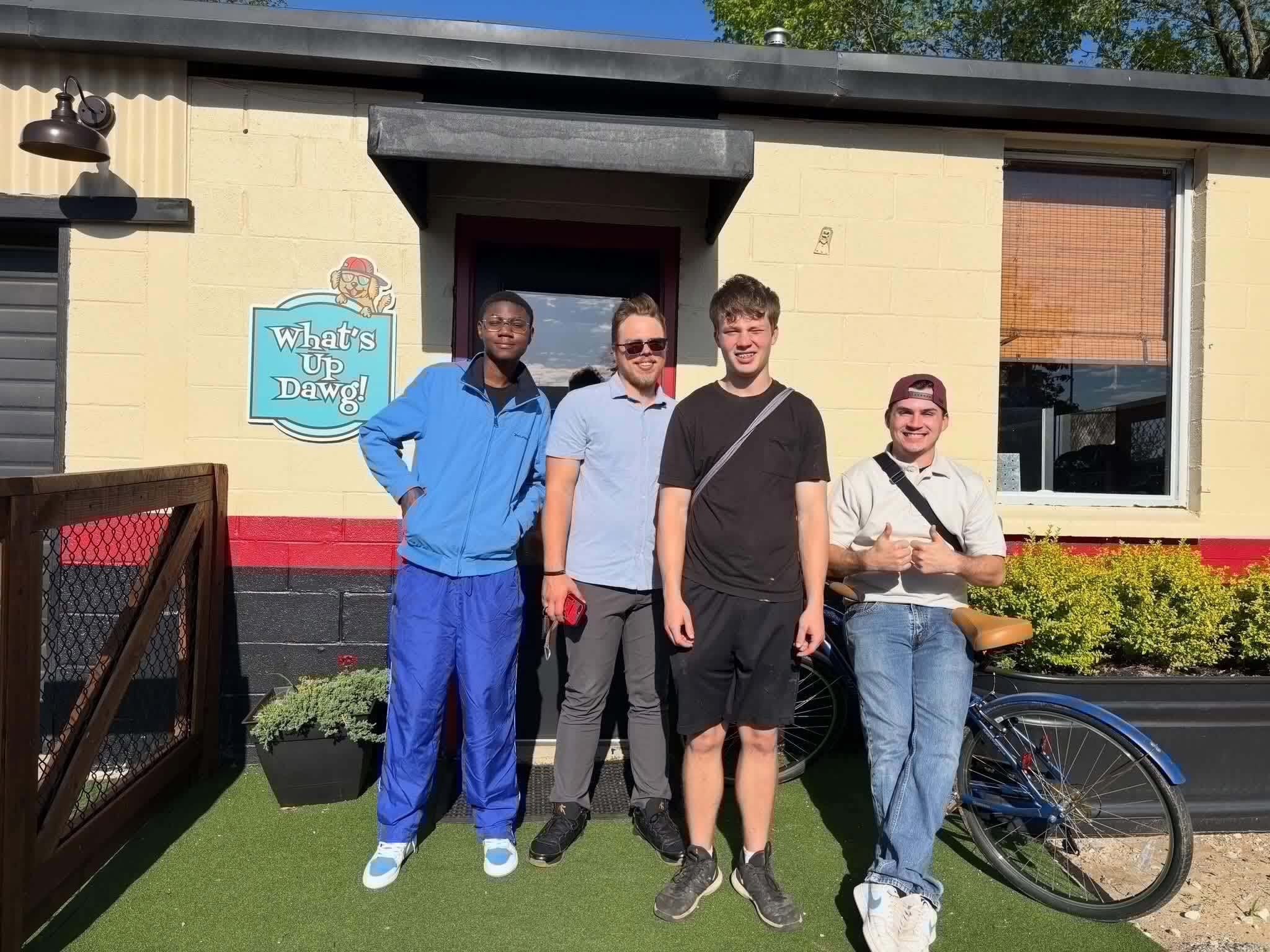 pet care staff in front of What's Up Dawg in Texas